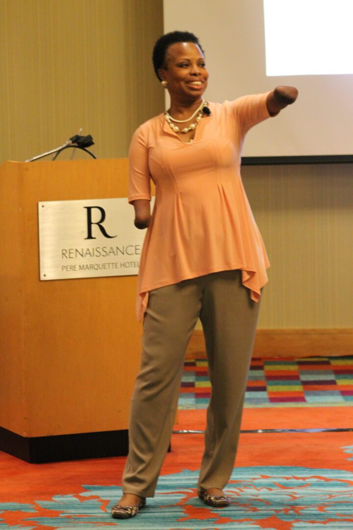 A woman standing in front of a microphone.